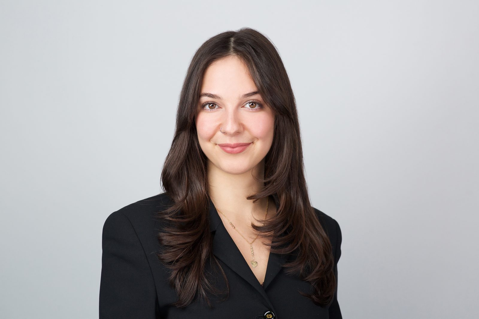 ERAS application photo — woman in a dark suit, Miami studio